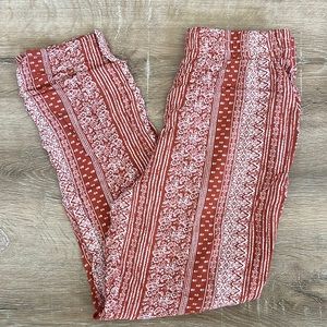 orange printed pants with pockets